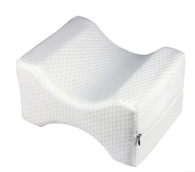 Angled view of contoured memory foam knee pillow