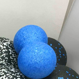 Peanut massage ball in use on back