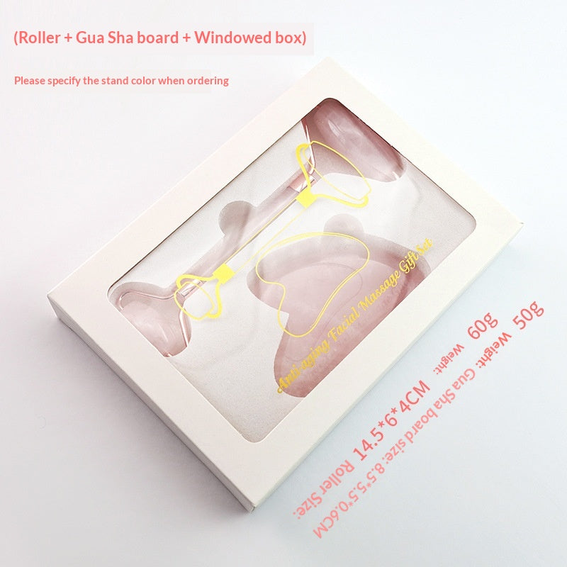 Rose quartz facial roller and heart-shaped gua sha stone in gift box